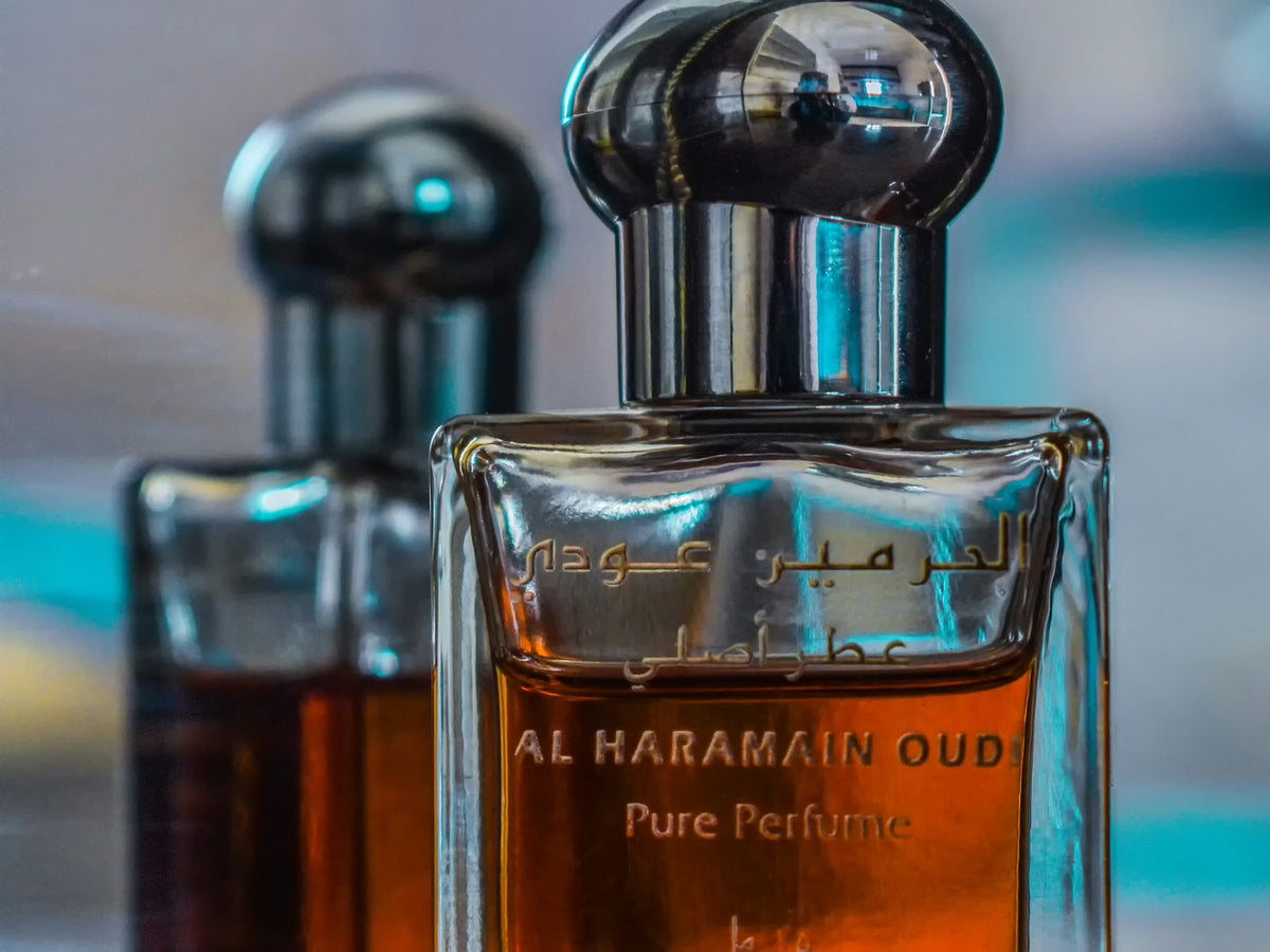 Al Haramain Oud pure perfume attar bottles in amber glass