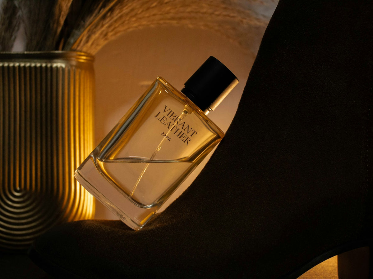 Swiss Arabian — golden perfume bottle lit by warm directional light
